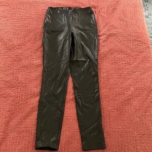 Guess black stretchy leather like pants fits women’s smaller size see photos